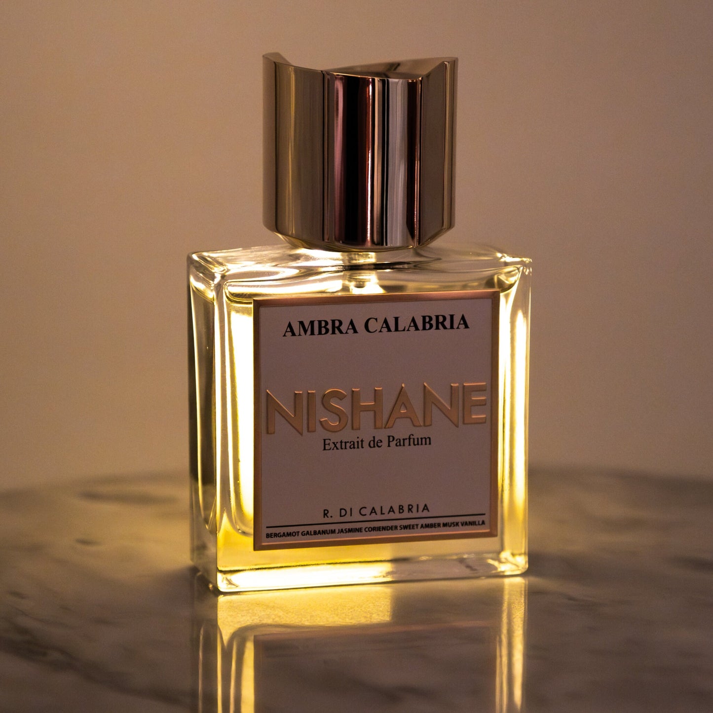 Nishane Ambra Calabria perfume bottle backlit