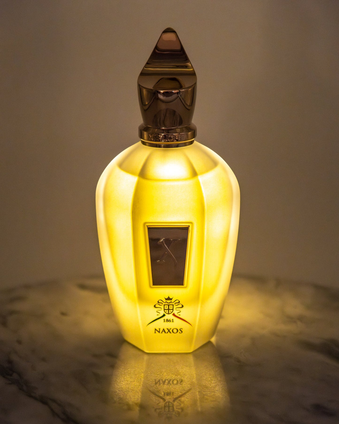 Xerjoff Naxos perfume bottle backlit